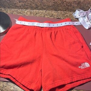 NWOT red Northface shorts with pockets size small women’s